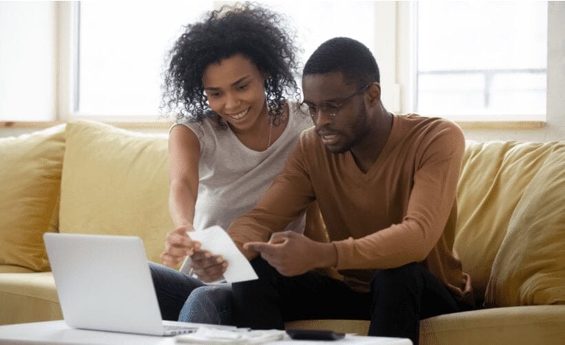 african american couple checking utilities liheap