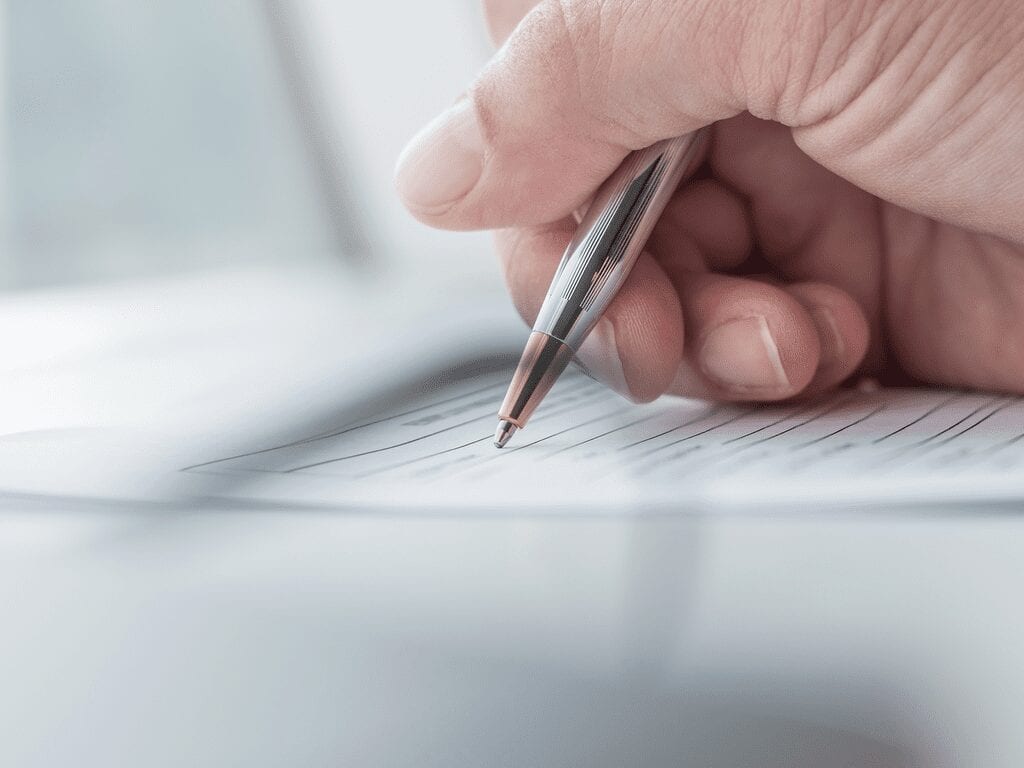 woman filling out form liheap denials