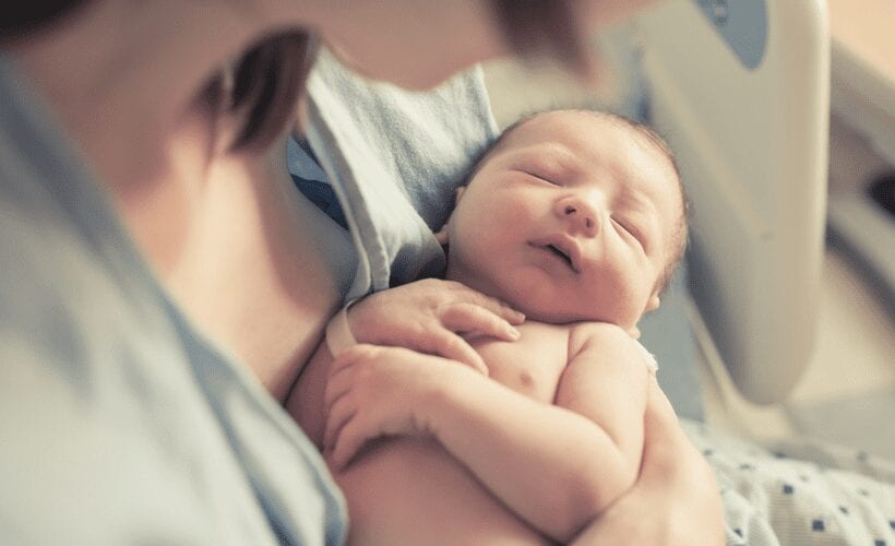 woman newborn baby chip delivery care