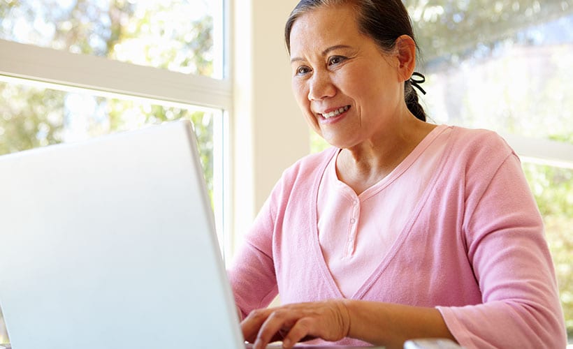 woman computer check status ssi application