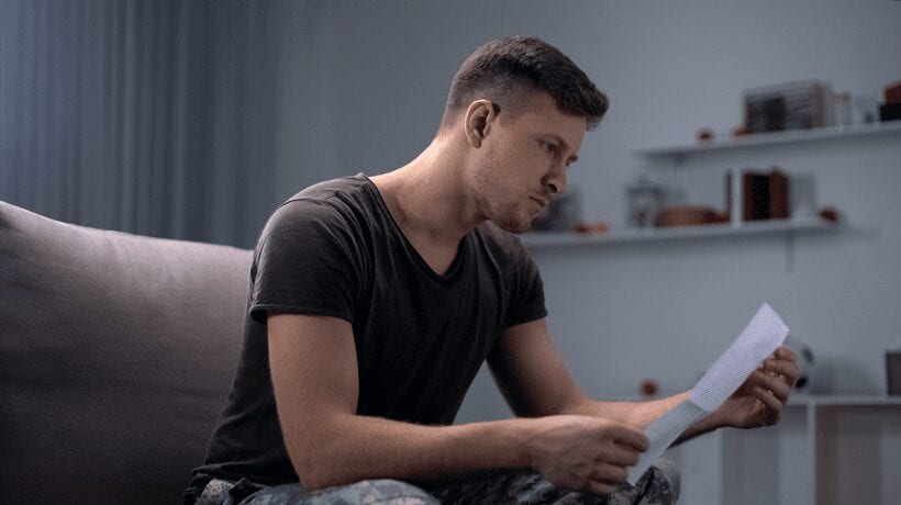 upset man reading letter appealing a gi bill decision