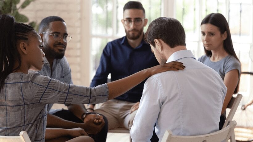 group consoling man bereavement and grief counseling