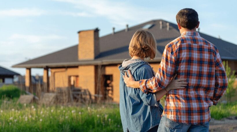 couple looking at house How to Find VA-Acquired Properties