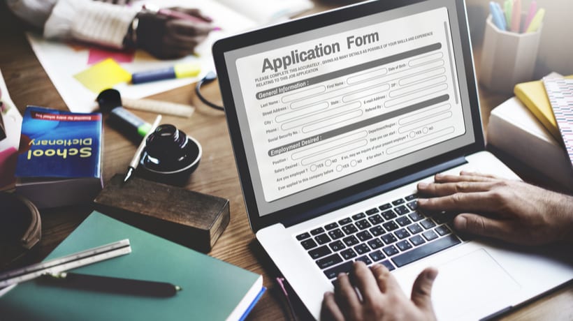 man filling out va benefits application form