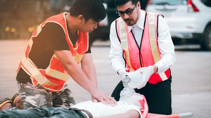 two men in vests with papers non-college-programs