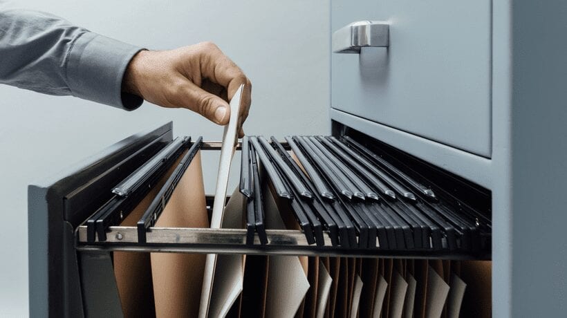 man putting file away va records